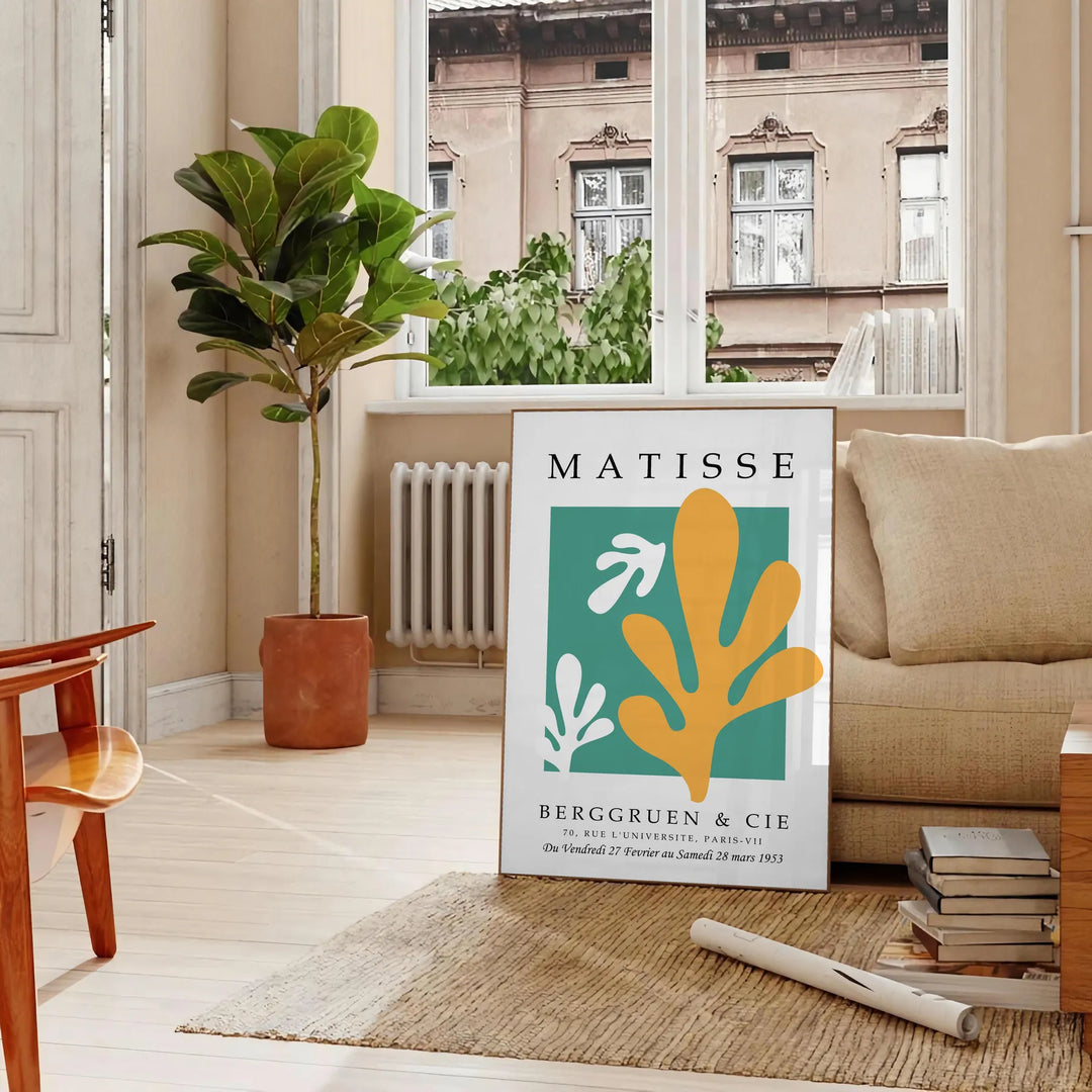 Abstract gray and white cut paper composition by Matisse - in a Parisian living room with a sofa and a fig plant