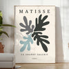 Gray and white Matisse papier découpé abstract poster in modern style. - in a bright minimalist room with a plant and an armchair
