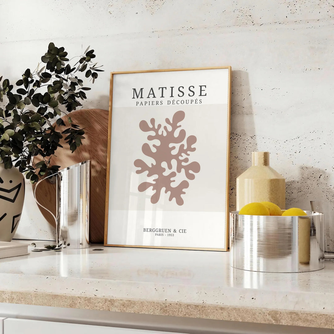 Abstract cut-out shapes in bold colors inspired by Matisse - styled on a counter with eucalyptus and a bowl of lemons