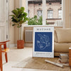 Black and white Matisse cut-outs poster, abstract papier découpés artwork - in a Parisian living room with a sofa and a fig plant
