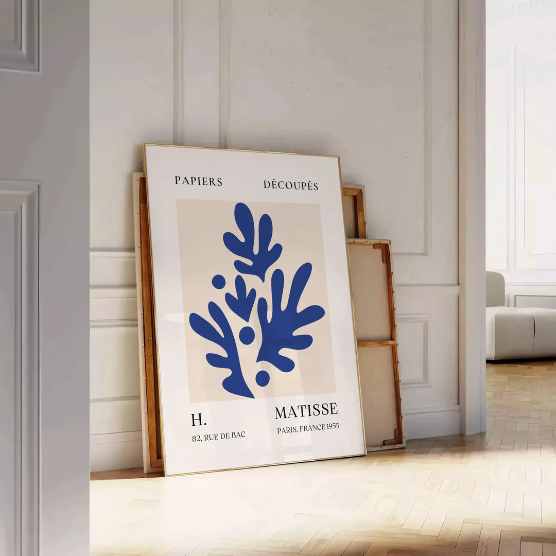 Colorful abstract shapes and forms in the style of Matisse - leaning on a herringbone floor against a white panelled wall