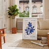 Colorful abstract shapes and forms in the style of Matisse - in a Parisian living room with a sofa and a fig plant