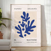 Colorful abstract shapes and forms in the style of Matisse - in a bright minimalist room with a plant and an armchair