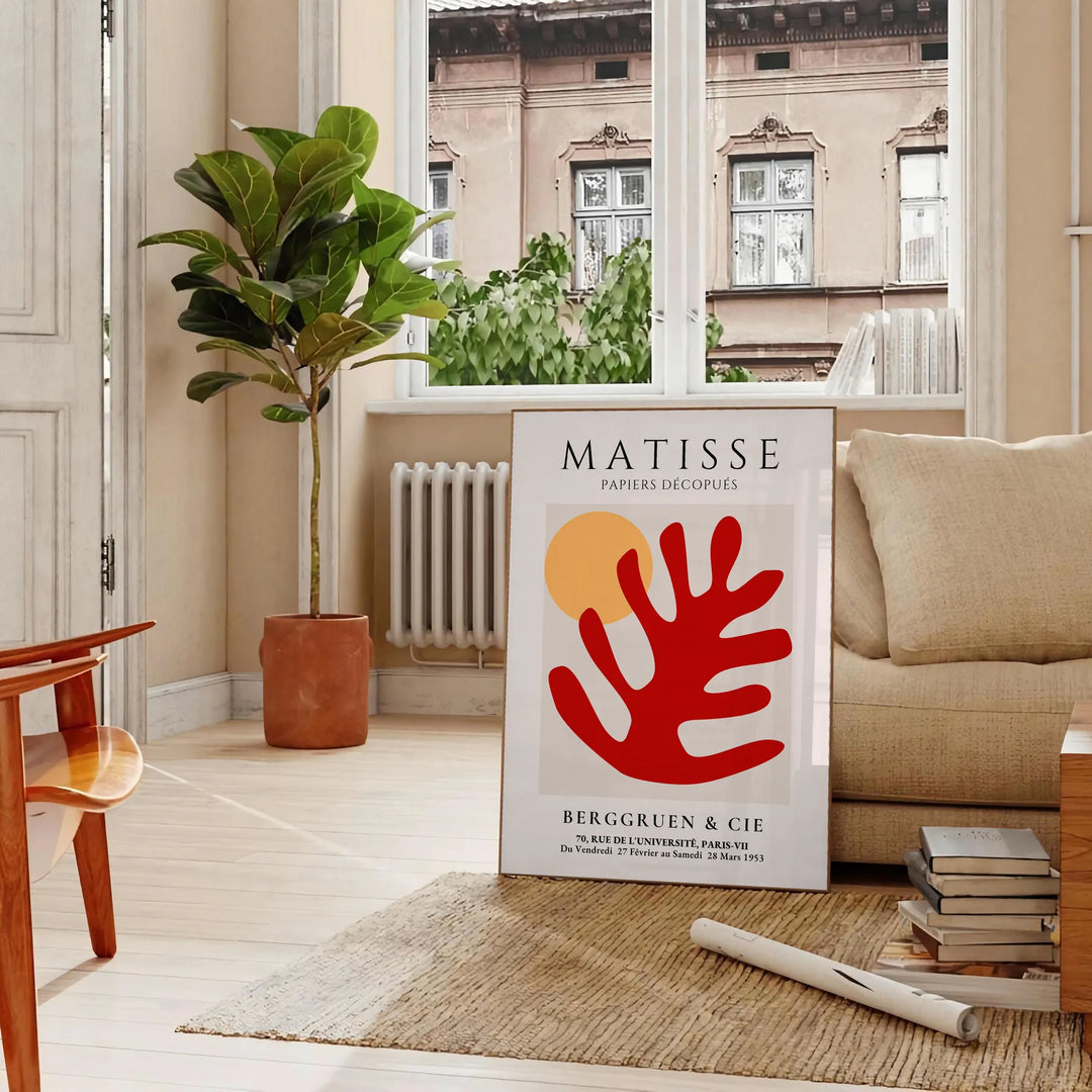 Colorful abstract shapes and forms inspired by Matisse's style - in a Parisian living room with a sofa and a fig plant