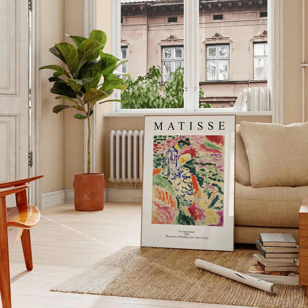 Abstract composition with bold colors and shapes inspired by Matisse - in a Parisian living room with a sofa and a fig plant