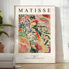 Abstract composition with bold colors and shapes inspired by Matisse - in a bright minimalist room with a plant and an armchair