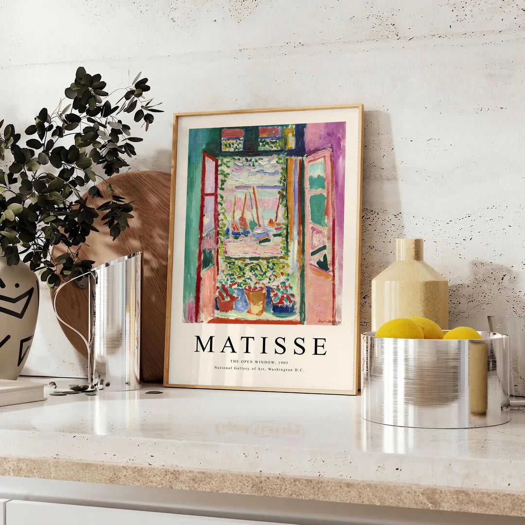 Matisse-inspired cutout design with orange and blue shapes - styled on a counter with eucalyptus and a bowl of lemons