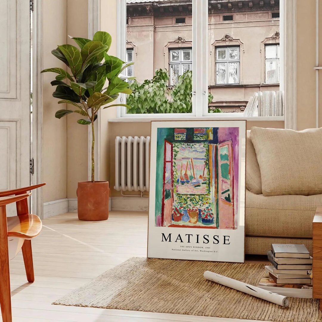 Matisse-inspired cutout design with orange and blue shapes - in a Parisian living room with a sofa and a fig plant