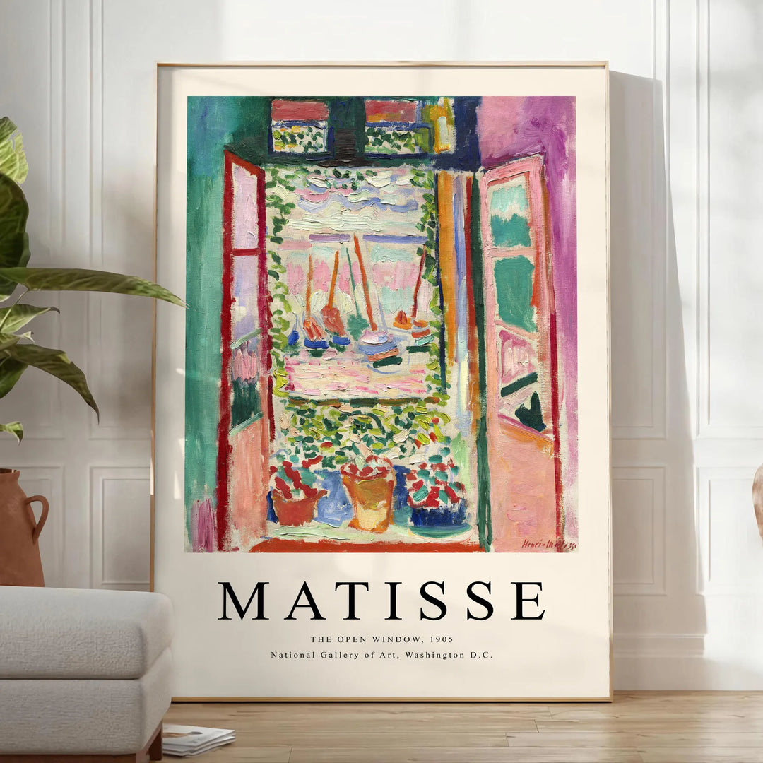 Matisse-inspired cutout design with orange and blue shapes - in a bright minimalist room with a plant and an armchair