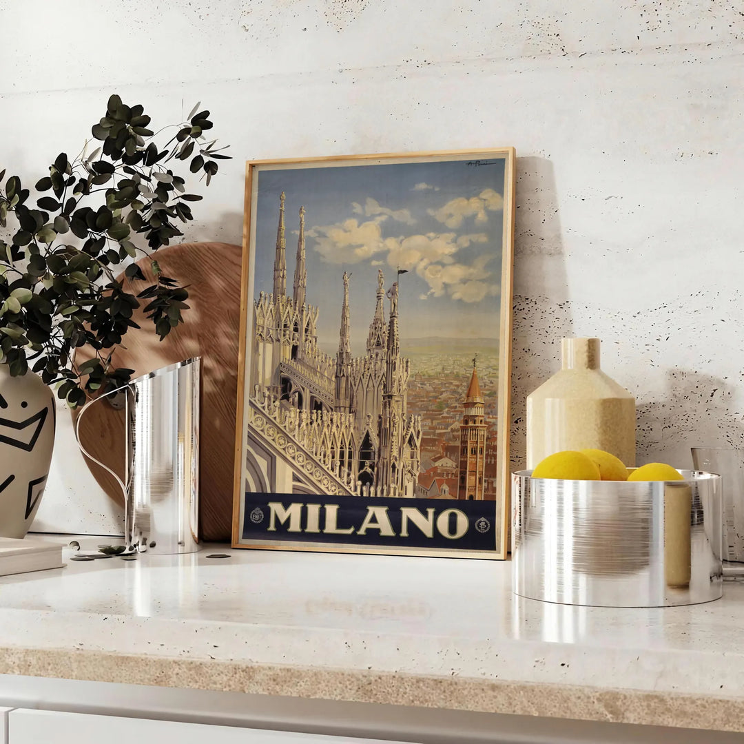 Stylized illustration of Milan's skyline with bold black and green colors - styled on a counter with eucalyptus and a bowl of lemons