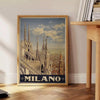 Stylized illustration of Milan's skyline with bold black and green colors - beside a round wooden side table with books