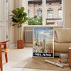 Stylized illustration of Milan's skyline in black and green - in a Parisian living room with a sofa and a fig plant