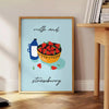 A colorful illustration of milk and strawberries with green and orange tones - beside a round wooden side table with books