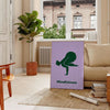 abstract representation of a person practicing yoga in calming green and blue tones - in a Parisian living room with a sofa and a fig plant