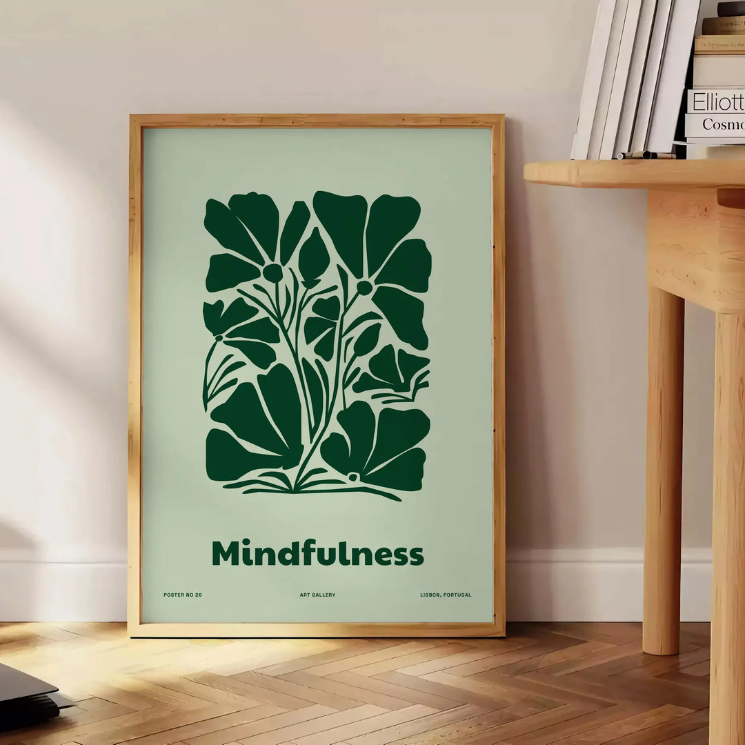 A serene yoga silhouette in green and gray tones against a textured background - beside a round wooden side table with books