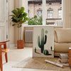 Minimalist cactus illustration in black and gray tones - in a Parisian living room with a sofa and a fig plant