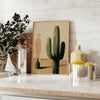 Illustration minimaliste d'un cactus en tons verts et noirs - sur un plan de travail avec eucalyptus et coupe de citrons