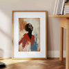 Minimalist portrait featuring bold red and green colors - beside a round wooden side table with books