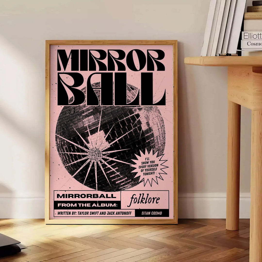 A mirror ball surrounded by intricate folklore patterns in black and brown hues - beside a round wooden side table with books