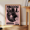 A reflective disco ball surrounded by abstract black and orange patterns - beside a round wooden side table with books