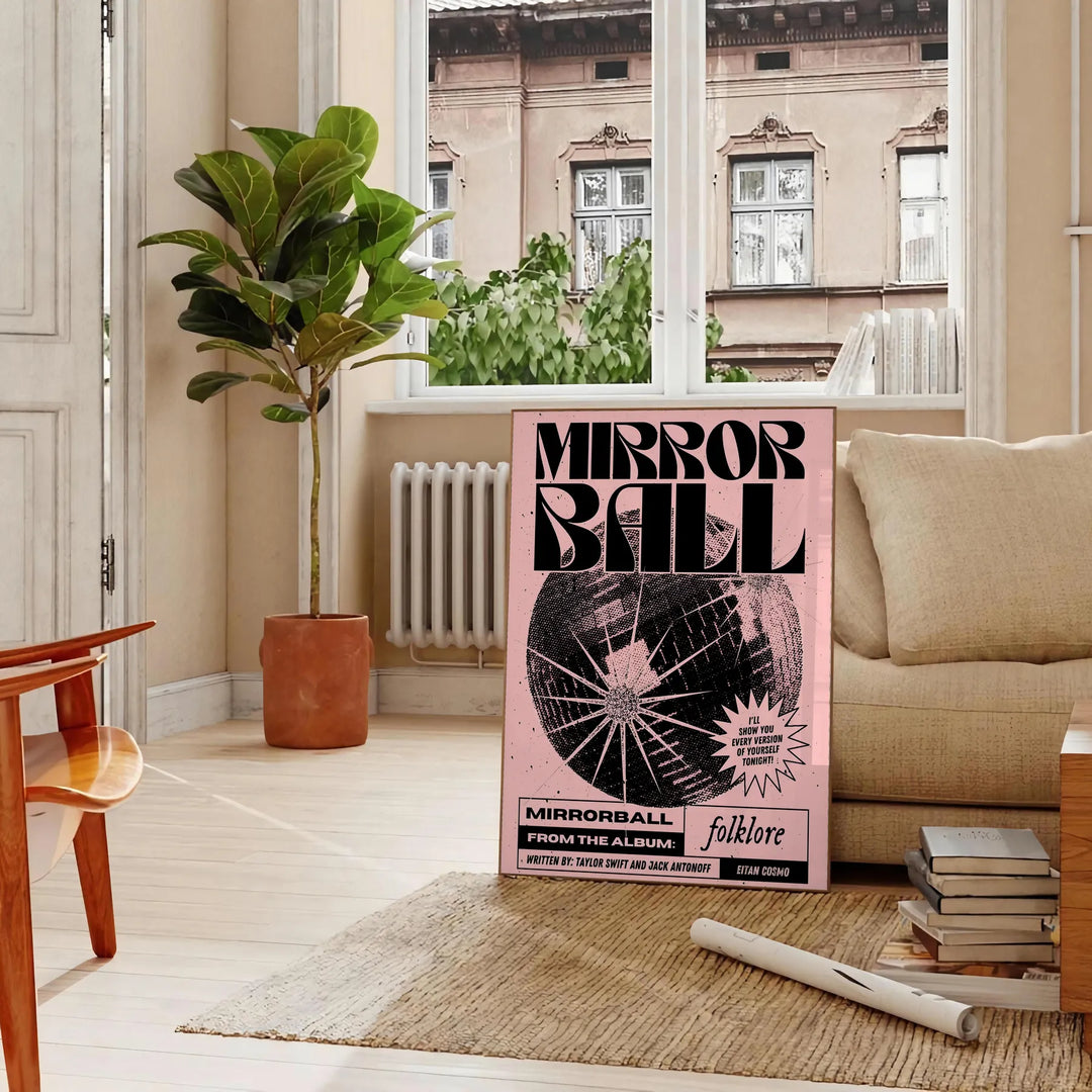 A reflective disco ball surrounded by abstract black and orange patterns - in a Parisian living room with a sofa and a fig plant