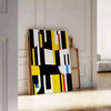 Abstract composition with orange and black shapes in a modern style - leaning on a herringbone floor against a white panelled wall