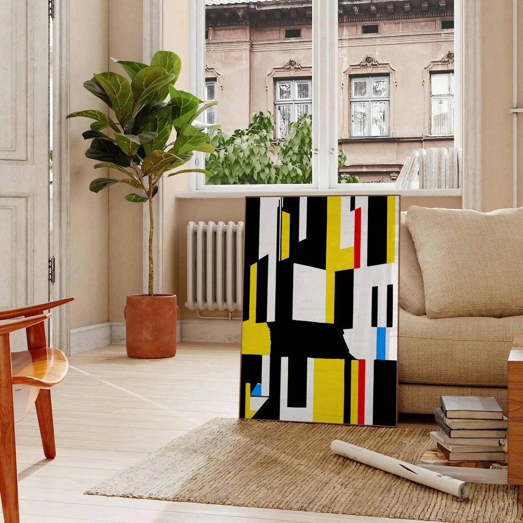 Abstract composition with orange and black shapes in a modern style - in a Parisian living room with a sofa and a fig plant