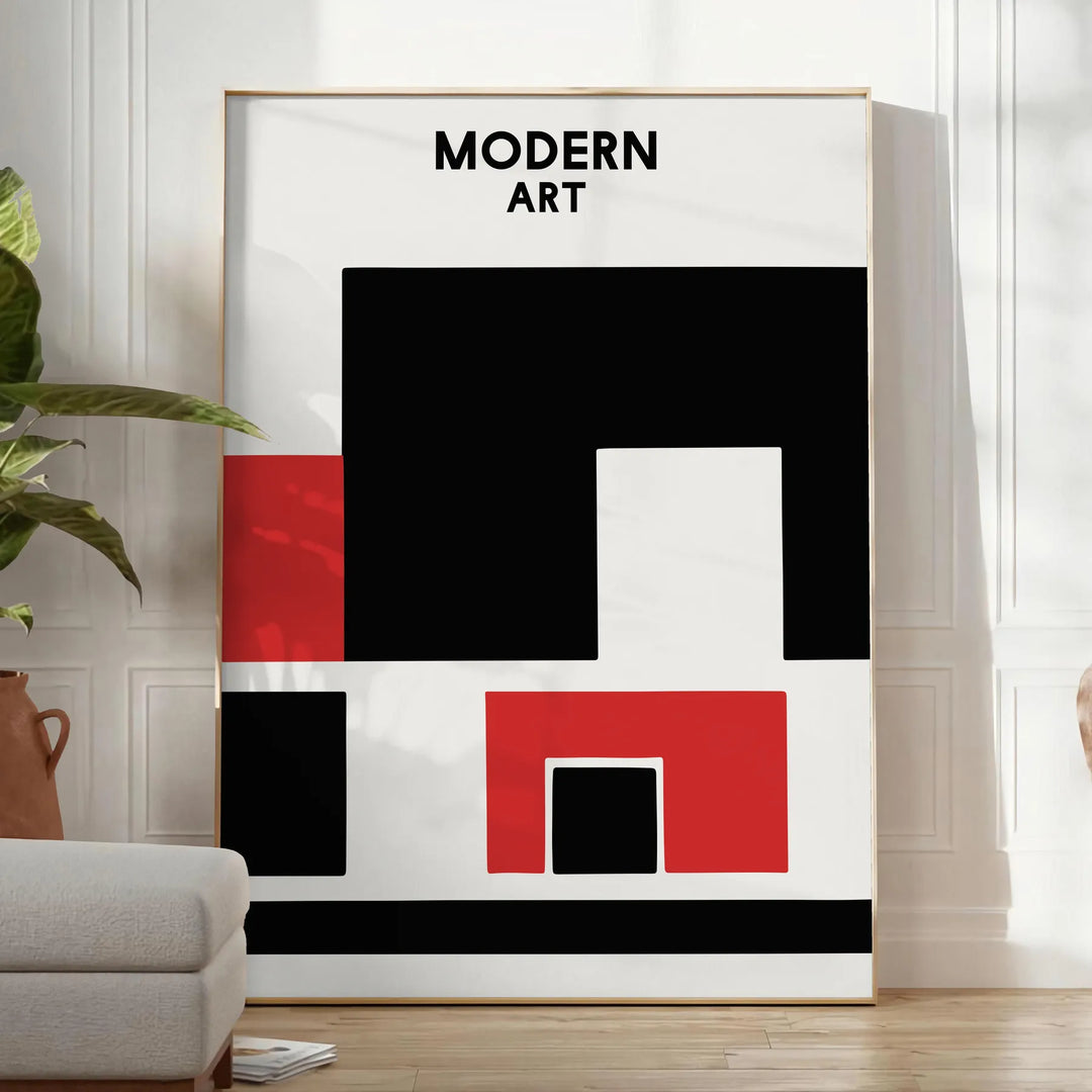Composição abstrata com formas dinâmicas em preto e vermelho - num quarto luminoso e minimalista com planta e poltrona