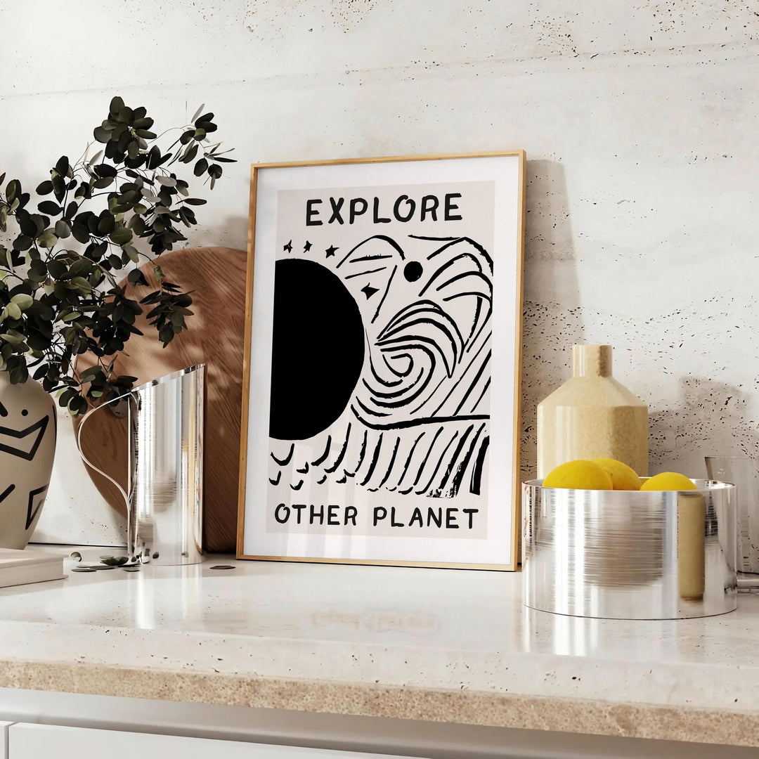 abstract black and white design depicting an imaginative cosmic landscape - styled on a counter with eucalyptus and a bowl of lemons
