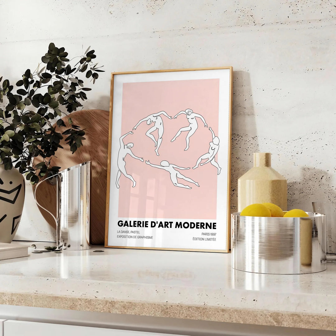 Abstract composition with black and orange shapes in a modern style - styled on a counter with eucalyptus and a bowl of lemons