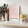 Abstract composition with black and orange shapes in a modern style - styled on a counter with eucalyptus and a bowl of lemons