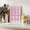 Abstract modern art with brown and white hues in a space theme - styled on a counter with eucalyptus and a bowl of lemons