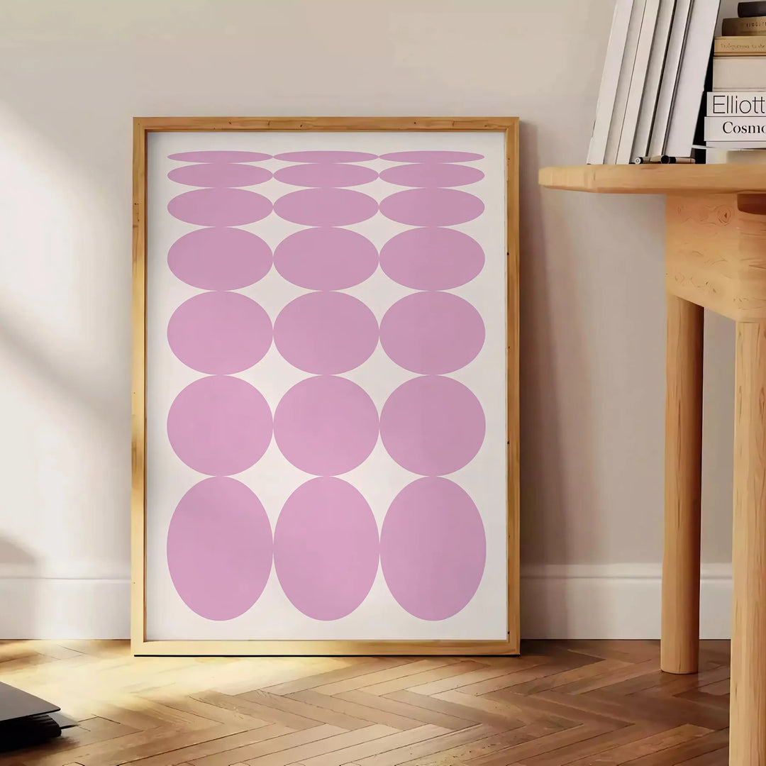 Abstract modern art with brown and white hues in a space theme - beside a round wooden side table with books