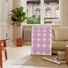 Abstract modern art with brown and white hues in a space theme - in a Parisian living room with a sofa and a fig plant
