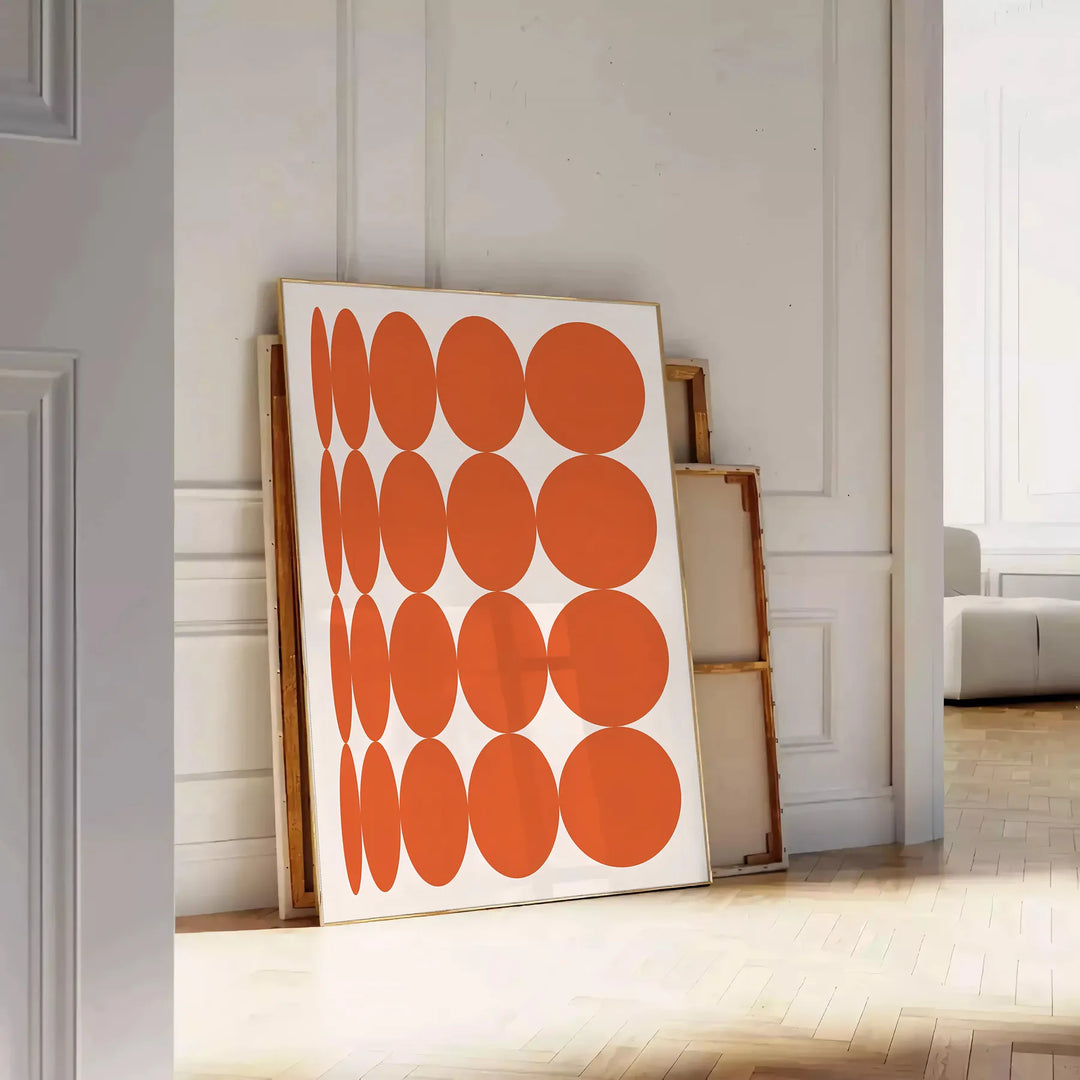 Abstract composition with orange and earthy brown tones in a modern style - leaning on a herringbone floor against a white panelled wall