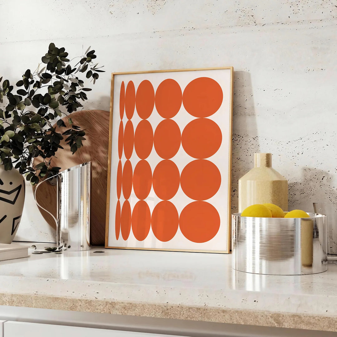 Abstract composition with orange and earthy brown tones in a modern style - styled on a counter with eucalyptus and a bowl of lemons