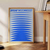 Abstract modern art with dynamic blue and gray shapes - beside a round wooden side table with books