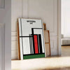 Abstract composition with bold black and red shapes on a white background - leaning on a herringbone floor against a white panelled wall