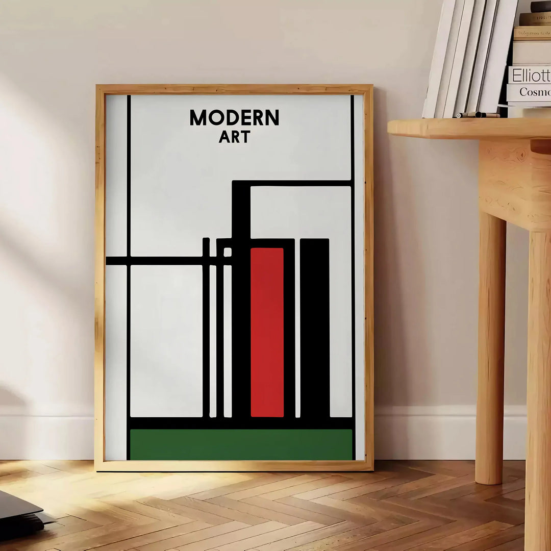 Abstract composition with bold black and red shapes on a white background - beside a round wooden side table with books