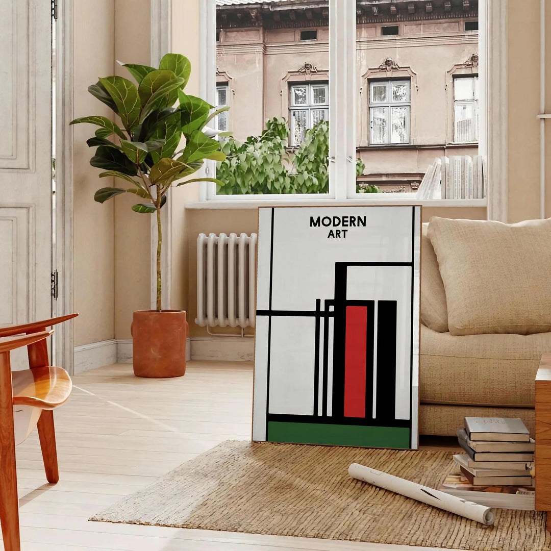 Abstract composition with bold black and red shapes on a white background - in a Parisian living room with a sofa and a fig plant