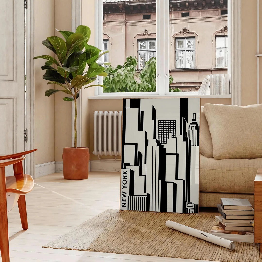 Abstract composition with black and orange shapes in a modern style - in a Parisian living room with a sofa and a fig plant