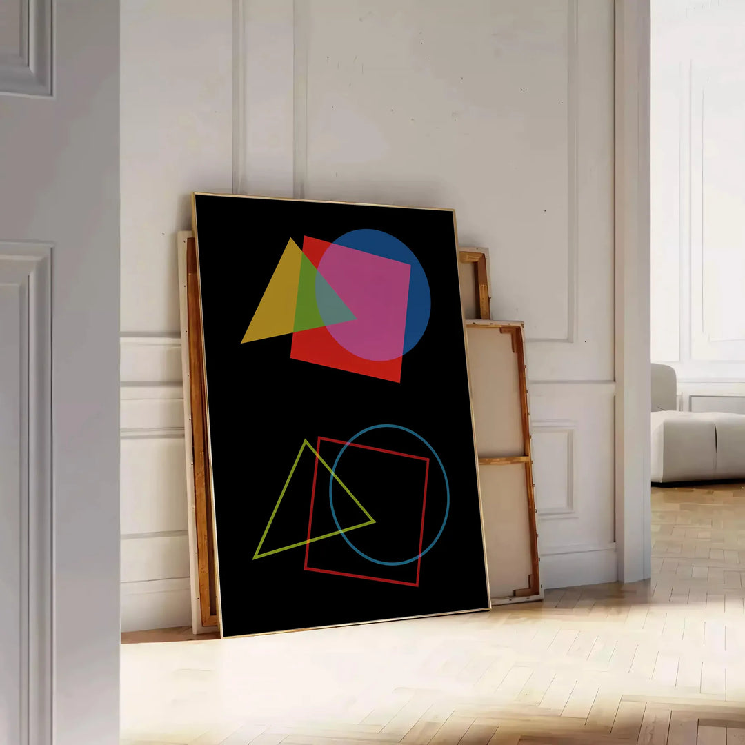 Abstract shapes in orange and black, modern art style - leaning on a herringbone floor against a white panelled wall