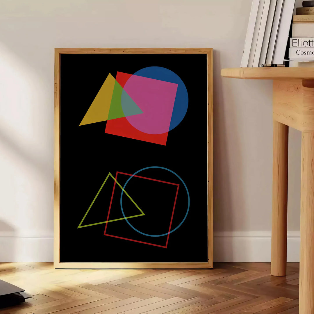 Abstract shapes in orange and black, modern art style - beside a round wooden side table with books