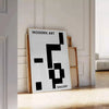 Abstract composition with black and blue shapes and lines - leaning on a herringbone floor against a white panelled wall