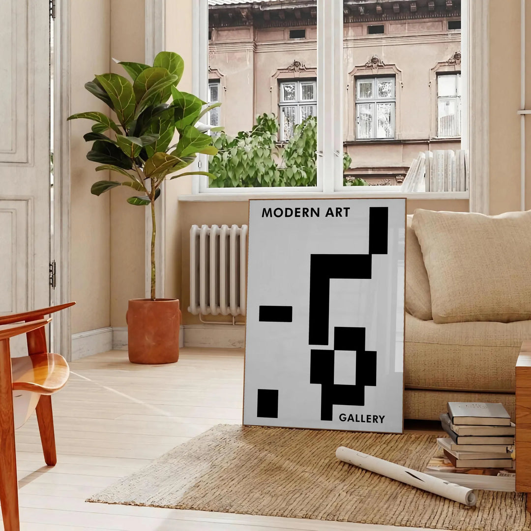 Abstract composition with black and blue shapes and lines - in a Parisian living room with a sofa and a fig plant