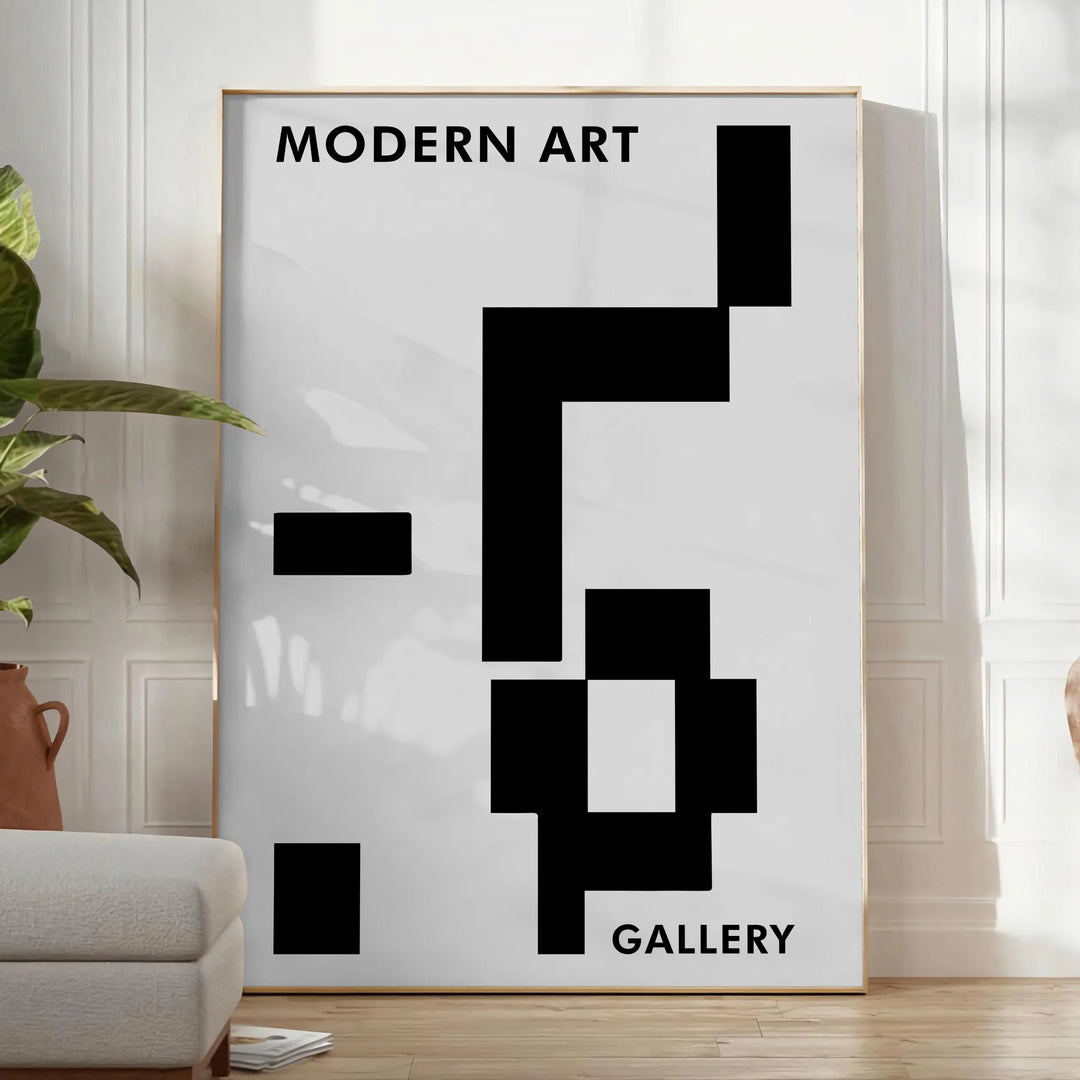 Abstract composition with black and blue shapes and lines - in a bright minimalist room with a plant and an armchair
