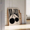 Abstract design featuring cherries in black and orange hues - leaning on a herringbone floor against a white panelled wall