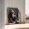 A playful monkey wearing glasses and a hoodie, surrounded by digital elements in green and gray. - leaning on a herringbone floor against a white panelled wall