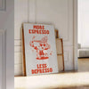 A kitchen print featuring bold orange and blue typography with coffee motifs - leaning on a herringbone floor against a white panelled wall