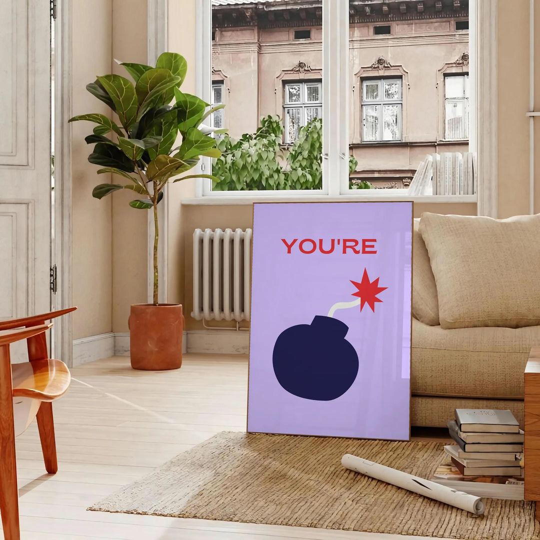 Abstract design featuring orange and blue tones with motivational text - in a Parisian living room with a sofa and a fig plant